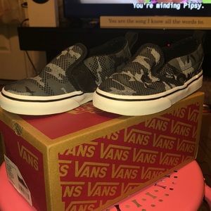 Vans slip on. Black camo print.